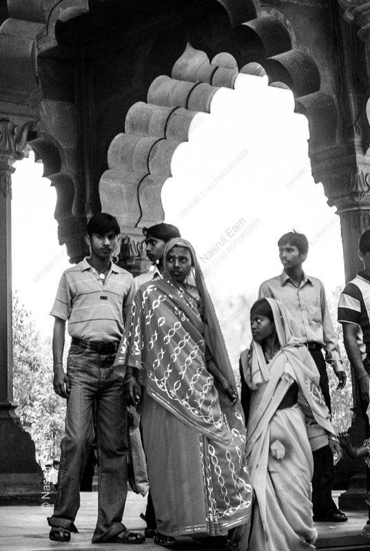 Figures Within the Scalloped Arch