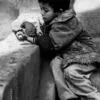 Hunched over a Crumbling Piece of Bread - Fine Art Photography Print, Limited Edition Photography, Giclée Print, Documentary Photography, Art Photography for Sale