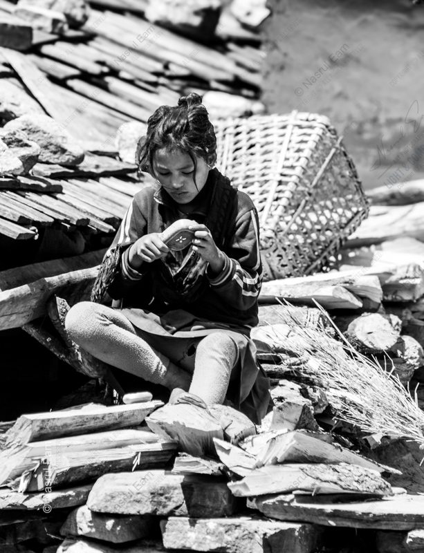 A Girl's Quiet Work on a Stone Wall
