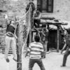 Boys' Volleyball Game by the Stone House