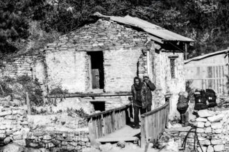 Travelers by the Stone House Bridge