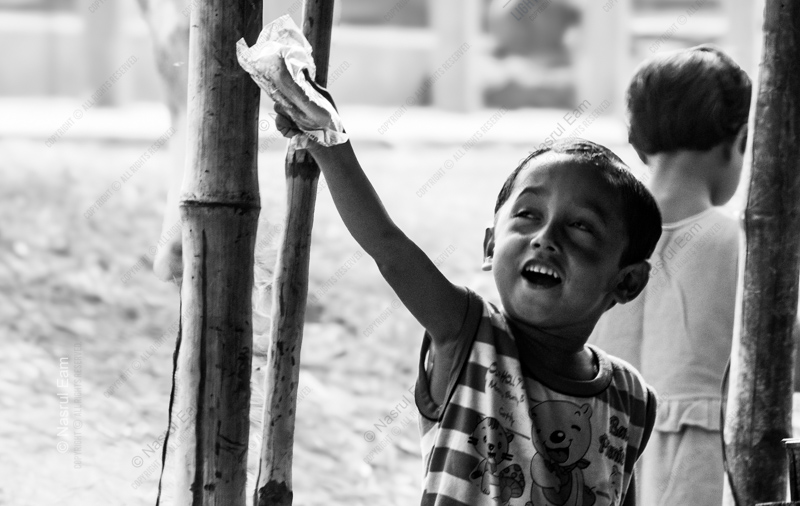 Boy Reaching Upward with a Gift