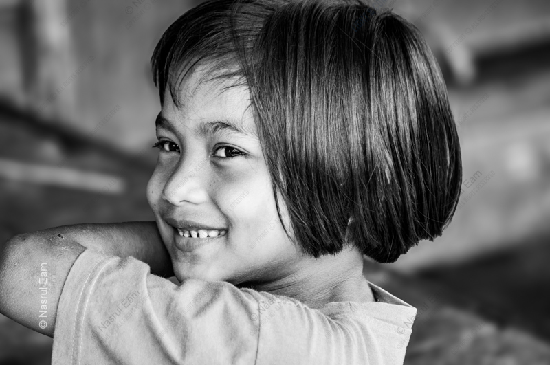 A Young Girl's Smile Over Her Shoulder