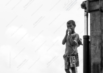 Boy with a Treat by the Steel Post - Fine Art Photography Print, Limited Edition Photography, Giclée Print, Monochrome Photography, Art Photography