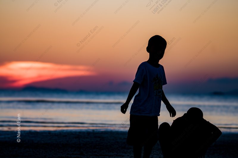Silhouettes on the Evening Shore