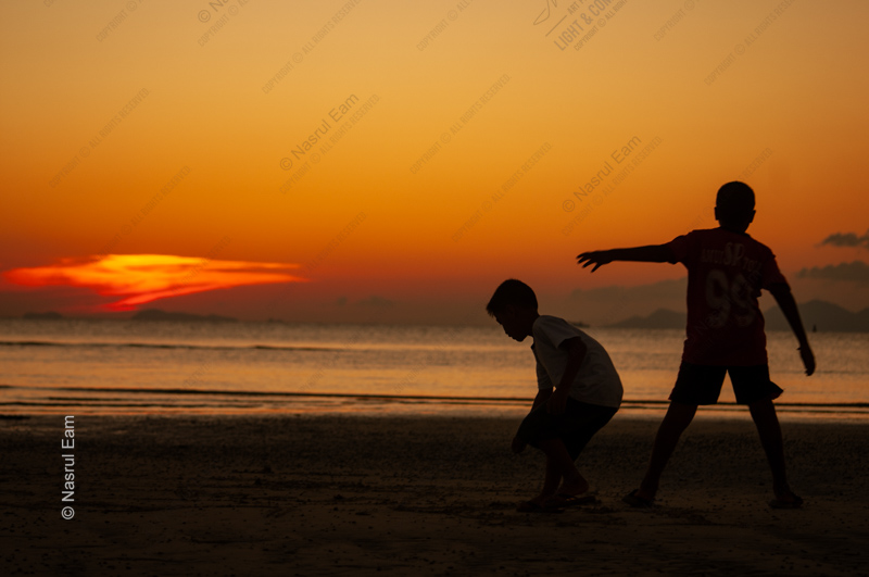 Two Boys on the Shore at Sundown