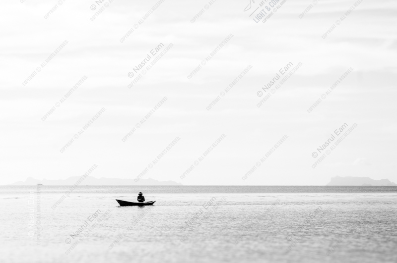 The Solitary Boatman on a Silver Sea