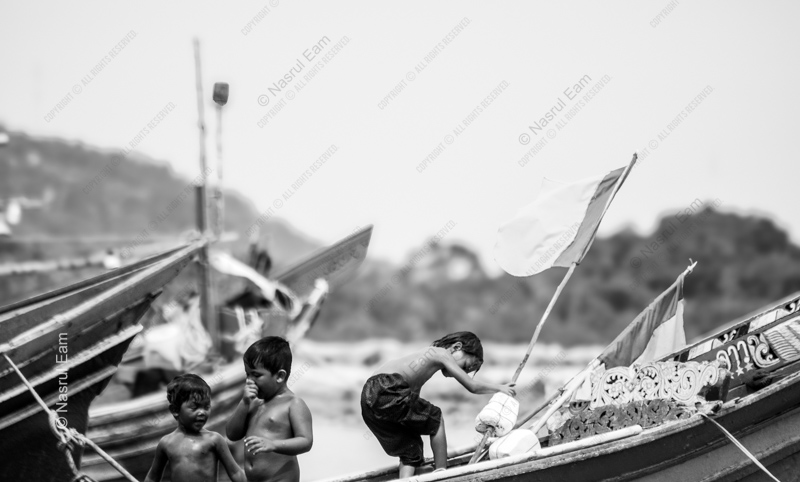 Three Children Among the River Boats