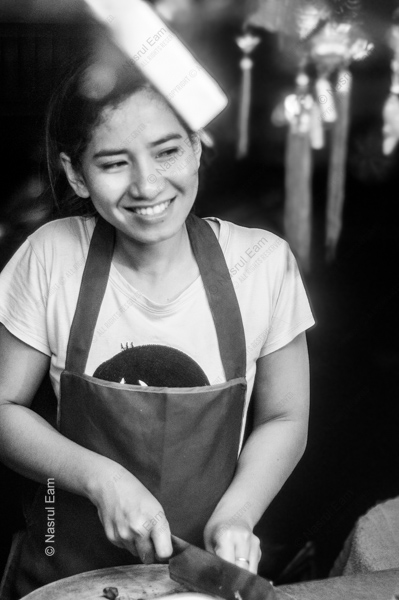 The Smiling Cook at Her Board