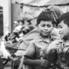 Whispers on the Festive Street - Fine Art Photography Print, Limited Edition Print, Monochrome Photography,  Documentary Photography, Art Photography Collectors