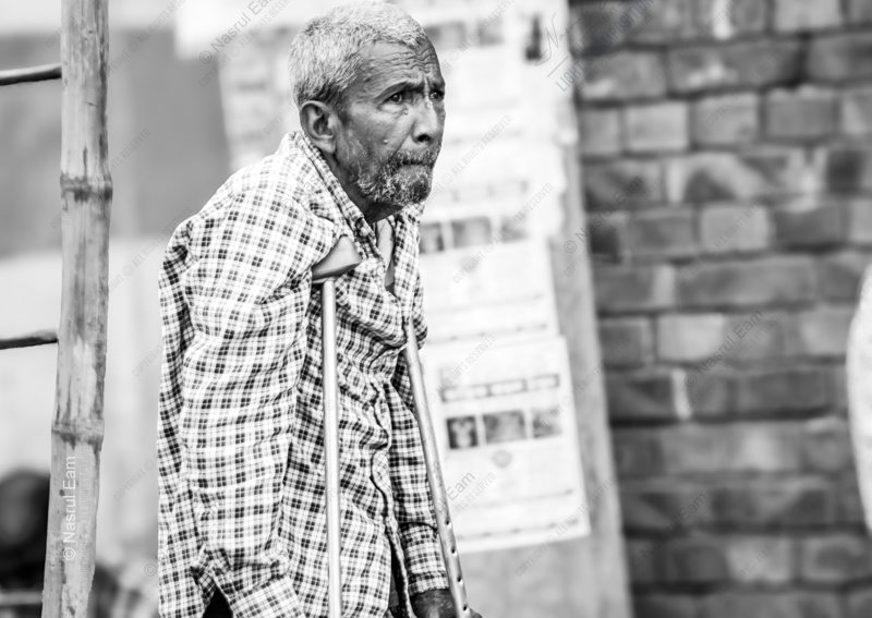 A Man with Crutches - Fine Art Photography Print, Limited Edition Photography, Black and White Photography, Humanist Photography, Nasrul Eam
