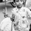 Boy with Pinwheel and Jhal Muri - Fine Art Photography Print, Limited Edition Print, Monochrome Photography,  Art Photography,  Contemporary Photography