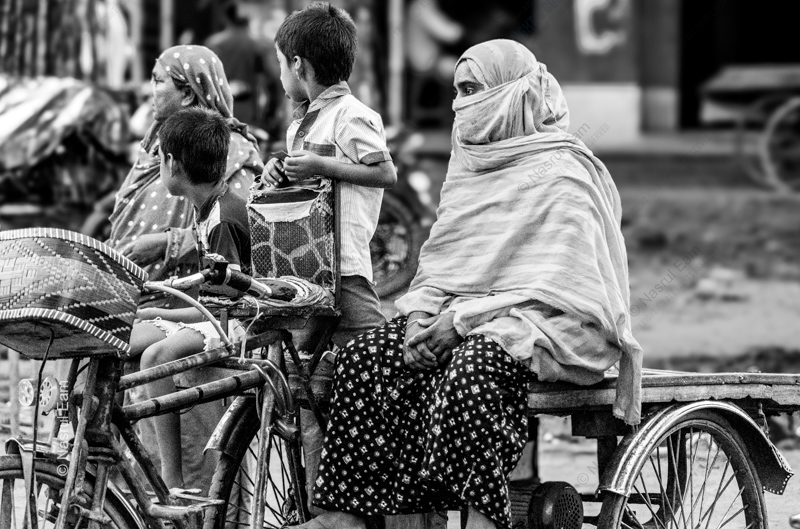 Veiled Traveler on a Cycle Rickshaw