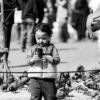 A Child with a Cup, Among the Pigeons - Fine Art Photography Print, Limited Edition Photography, Giclée Print,  Black and White Photography,  Art Photography Investment