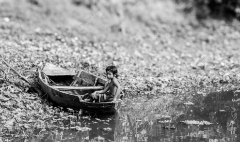 Boy in a Wooden Boat - Fine Art Photography Print, Limited Edition Photography, Monochrome Photography,  Boy in Boat, Nasrul Eam