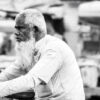 The Blurred Activity Surrounding Him - Fine Art Photography Print, Limited Edition Photography, Giclée Print, Monochrome Portrait,  Art Photography for Sale