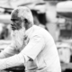 The Blurred Activity Surrounding Him - Fine Art Photography Print, Limited Edition Photography, Giclée Print, Monochrome Portrait,  Art Photography for Sale