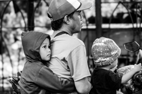 A Child's Hold on a Father's Back