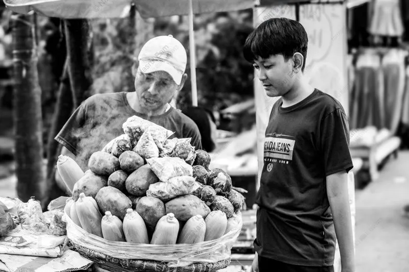 A Boy Before the Steaming Basket