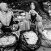 A Conversation Between Market Vendors