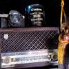 Camera and Lens on a Vintage Radio