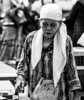 Elderly Woman in a Patterned Tunic