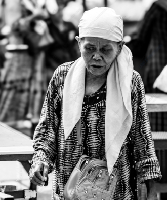Elderly Woman in a Patterned Tunic