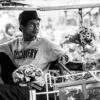 A Young Man in a Flower-Adorned Cart - Fine Art Photography Print, Limited Edition Photography, Monochrome Photography, Giclée Print, Documentary Photography