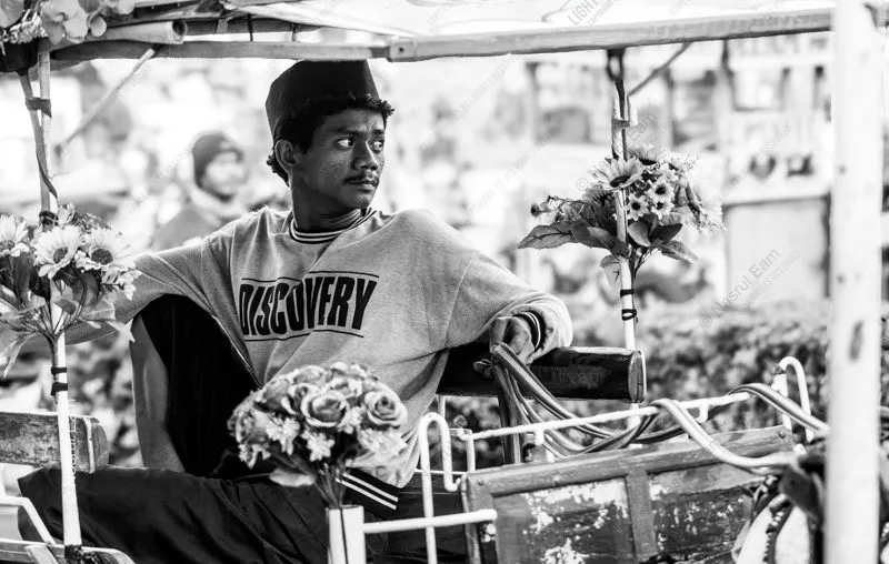 A Young Man in a Flower-Adorned Cart - Fine Art Photography Print, Limited Edition Photography, Monochrome Photography, Giclée Print,  Documentary Photography