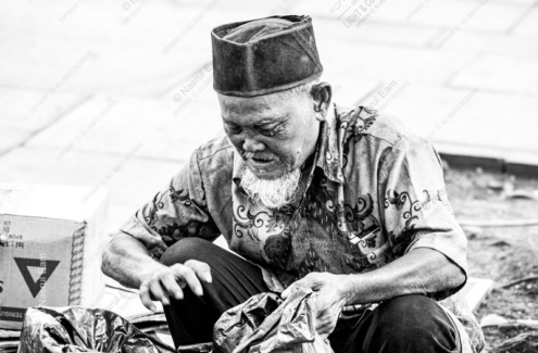 An Elder Sorting His Wares - Fine Art Photography Print, Limited Edition Photography, Museum-Quality Photography, Black and White Photography, Photography Art for Collectors