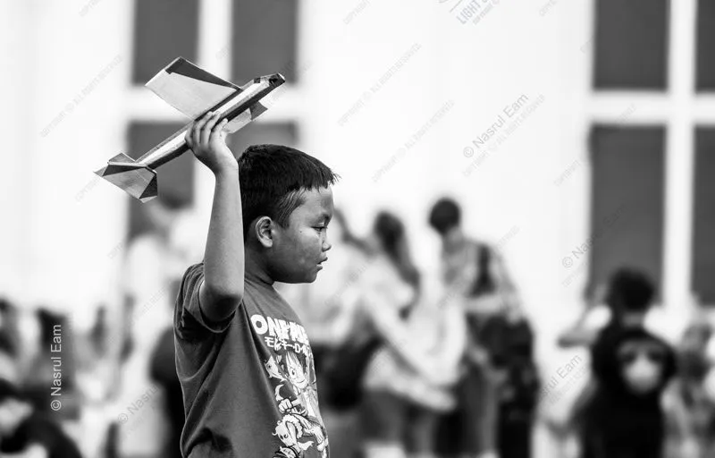 A Boy Lifting His Airplane - Fine Art Photography Print, Limited Edition Photography, Museum-Quality Photography, Art Photography for Collectors, High-End Photography Prints
