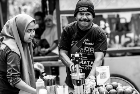The Juice Vendor's Welcoming Gaze - Fine Art Photography Print, Limited Edition Photography, Street Portraiture, Black and White Photography, Documentary Photography
