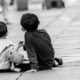 Two Boys on a Wooden Walkway