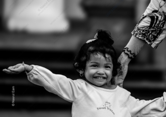 A Child's Joyful Reach