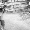 Boy with a Crate of Bottles - Fine Art Photography Prints, Limited Edition Photography, Giclée Print, Black and White Photography, Contemporary Art Photography