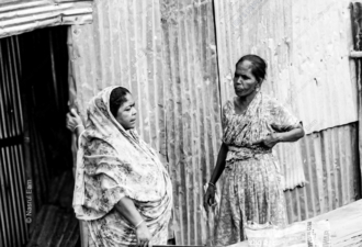 Conversation by the Corrugated Wall - Fine Art Photography Prints, Limited Edition Photography, Black and White Photography, Documentary Photography, Art Photography for Sale