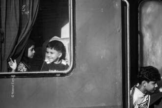 Children at the Train Window - Children train window photography, visual storytelling photography, photo composition light study, emotional connection photography, black and white photography guide, contemporary photography journals