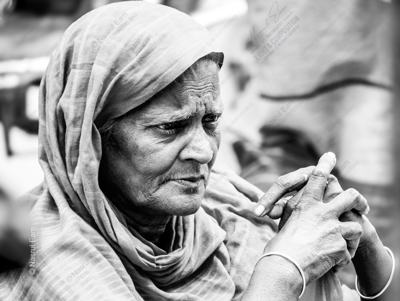 Elderly Woman with Clasped Hands