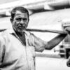 Man with a Carrying Beam - photography portrait, visual storytelling, black and white photography, light and composition, human dignity, documentary photography