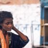 Woman with an Orange Scarf - photography portrait, visual storytelling, contemporary photography, human condition, artistic expression, photographic art