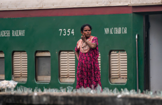 Woman at the Railway Wall - photography portrait, visual storytelling photography, photography composition, environmental portraiture, photography education, contemporary photography