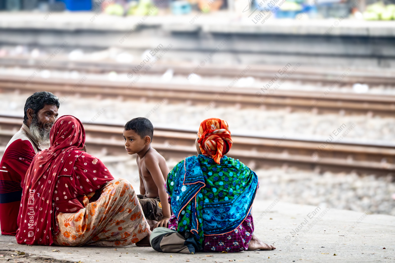 Family by the Railway Tracks