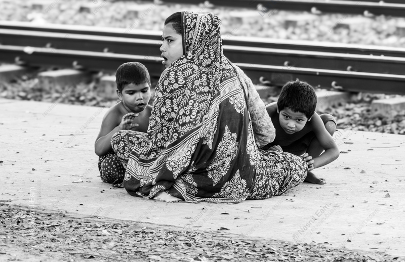 A Family by the Train Tracks