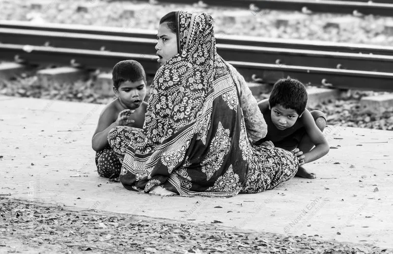 A Family by the Train Tracks - photography composition, documentary portraiture, visual storytelling, photography techniques, human emotion photography