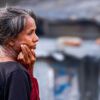 Woman in Red, Hand to Cheek - fine art photography, portrait photography, visual storytelling, photography techniques, aging and resilience