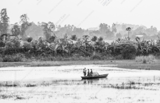 Figures in a Boat on the Hazy Water - boat photography composition, visual storytelling photography, monochrome photography techniques, humanistic photography art, tonal control photography, atmospheric photography