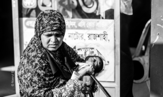 A Mother's Embrace by the Roadside - documentary photography, fine art photography, maternal care art, visual storytelling, portraiture techniques, photography art