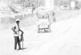 A Road Worker with His Flag - fine art photography, photography art prints, visual storytelling photography, documentary photography books, photography technique tutorials
