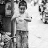A Boy and His Mother on the Roadside