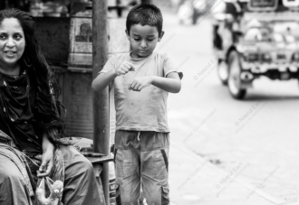 A Boy and His Mother on the Roadside